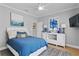 Serene bedroom featuring ocean-themed decor, a plush bed, and ample natural light at 10003 Brompton Dr, Tampa, FL 33626