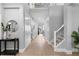 Spacious hallway with hardwood floors, ample storage, and staircase with iron railing at 10003 Brompton Dr, Tampa, FL 33626
