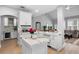 Contemporary kitchen with white cabinets, marble countertops, stainless steel appliances, and an island at 10003 Brompton Dr, Tampa, FL 33626