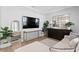 Inviting living space showcasing modern decor, a sleek TV, and cozy sectional sofa at 10003 Brompton Dr, Tampa, FL 33626