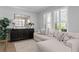 Bright living room featuring a stylish console table, decor, and comfortable seating arrangement at 10003 Brompton Dr, Tampa, FL 33626