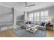 Bright and airy living room featuring a large window, comfortable sofa, and stylish decor at 10003 Brompton Dr, Tampa, FL 33626
