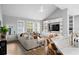 Bright and airy living room featuring an island, vaulted ceilings, plantation shutters and stylish decor at 10003 Brompton Dr, Tampa, FL 33626