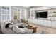 A bright living area with custom built-ins, and a comfortable sectional sofa at 10003 Brompton Dr, Tampa, FL 33626