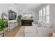 Comfortable living room with modern furnishings, a large TV, and plenty of natural light at 10003 Brompton Dr, Tampa, FL 33626