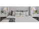 Comfortable main bedroom featuring stylish decor, lamps, throw pillows, and an accent blanket at 10003 Brompton Dr, Tampa, FL 33626