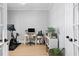 A serene home office with natural light, a desk, and an exercise bike at 10003 Brompton Dr, Tampa, FL 33626