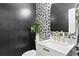 Stylish powder room features black and white wallpaper, a marble vanity, and gold fixtures at 10003 Brompton Dr, Tampa, FL 33626