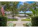 Picturesque street view with mature trees and a glimpse of the nearby lake at 10003 Brompton Dr, Tampa, FL 33626