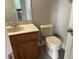 This bathroom features a sink with vanity, toilet, and tile flooring at 1008 Arista Blvd, Valrico, FL 33594