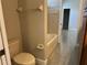 Bathroom featuring a tub, shower, toilet, and towel rack at 1008 Arista Blvd, Valrico, FL 33594