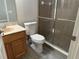 This bathroom features a toilet, sink with vanity, and glass enclosed walk-in shower at 1008 Arista Blvd, Valrico, FL 33594