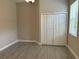 Bedroom with tile flooring, neutral paint and a double door closet and window at 1008 Arista Blvd, Valrico, FL 33594