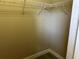 Walk-in closet with wire shelving and tile flooring at 1008 Arista Blvd, Valrico, FL 33594