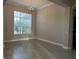 Dining area with a large window, tiled flooring, and neutral paint at 1008 Arista Blvd, Valrico, FL 33594