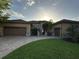 Beautiful home boasts well-manicured lawn, two-car garage, and stone accents at 1008 Arista Blvd, Valrico, FL 33594