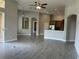Spacious living room with ceiling fan, recessed lights and tile flooring throughout the home at 1008 Arista Blvd, Valrico, FL 33594
