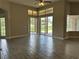 Bright living room featuring tile flooring and sliding glass doors that let in plenty of natural light at 1008 Arista Blvd, Valrico, FL 33594