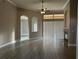 Spacious living room featuring tile floors, a ceiling fan, fireplace, and an archway at 1008 Arista Blvd, Valrico, FL 33594