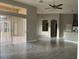 This large living room features tile flooring and access to the outdoor patio at 1008 Arista Blvd, Valrico, FL 33594