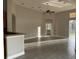 Open-concept living area featuring tile floors, high ceilings, and seamless flow to the outdoors at 1008 Arista Blvd, Valrico, FL 33594
