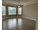 Large main bedroom with tray ceilings, tiled floors, and an abundance of natural light at 1008 Arista Blvd, Valrico, FL 33594