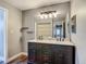 Bathroom featuring double sinks, vanity and open shelf at 10206 Evening Trail Dr, Riverview, FL 33569