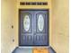 Close up of double front door with decorative glass and a cheerful 'Home Sweet Home' mat at 10206 Evening Trail Dr, Riverview, FL 33569