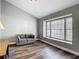 Cozy living room with LVP floors, neutral colors, and a large window offering plenty of natural light at 10206 Evening Trail Dr, Riverview, FL 33569