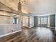 Spacious living room with luxury vinyl plank flooring, modern paint, and decorative pillars at 10206 Evening Trail Dr, Riverview, FL 33569