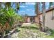 Cozy backyard with lush greenery, an outdoor dining area, and a tranquil space for relaxation at 10549 112Th Ave, Largo, FL 33773