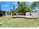 Spacious backyard with a charming deck and verdant greenery, creating a perfect outdoor retreat at 10549 112Th Ave, Largo, FL 33773