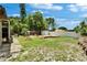 Expansive backyard featuring a deck and lush greenery, perfect for outdoor activities and relaxation at 10549 112Th Ave, Largo, FL 33773