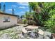 Charming backyard with a stone table set and abundant greenery, perfect for relaxation and entertaining at 10549 112Th Ave, Largo, FL 33773