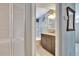 Bathroom featuring granite counters, tiled shower, and glass shower door, as seen from doorway at 10549 112Th Ave, Largo, FL 33773