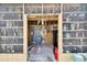 Unique cabana featuring eclectic decor, shelving and seating for relaxing and entertaining at 10549 112Th Ave, Largo, FL 33773