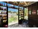 Eclectic cabana with shelving and unique decor, offering a space for relaxation and outdoor enjoyment at 10549 112Th Ave, Largo, FL 33773