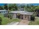 Charming single-story home featuring a quaint brick walkway and mature landscaping at 10549 112Th Ave, Largo, FL 33773