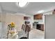Kitchen featuring dark wood cabinets, appliances, and a view from the dining area at 10549 112Th Ave, Largo, FL 33773