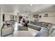 Bright living room featuring tile floors, modern ceiling fans, and cozy seating arrangements at 10549 112Th Ave, Largo, FL 33773