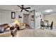 Comfortable living area featuring wood-look floors, modern furnishings, and a dining area at 10549 112Th Ave, Largo, FL 33773