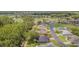 Aerial view of homes overlooking a lush golf course with ponds and tree-lined streets at 10728 Moshie Ln, San Antonio, FL 33576