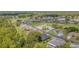 Aerial view showcasing a golf course community and residential neighborhood at 10728 Moshie Ln, San Antonio, FL 33576