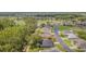 Aerial view of the home showcasing its location near a lush golf course and serene pond at 10728 Moshie Ln, San Antonio, FL 33576