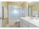 Bathroom featuring a single sink vanity, a toilet, and a shower/tub combo at 10728 Moshie Ln, San Antonio, FL 33576