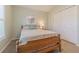 Cozy bedroom with wood furniture, light green walls, and double door closet at 10728 Moshie Ln, San Antonio, FL 33576