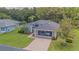 Attractive single-Gathering home with a well-manicured lawn and screened garage at 10728 Moshie Ln, San Antonio, FL 33576