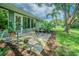 Charming patio area with a garden, perfect for outdoor relaxation at 10728 Moshie Ln, San Antonio, FL 33576
