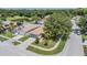 Overhead view of a cozy residential neighborhood with houses, trees, and lake at 11022 Connacht Way, Tampa, FL 33610