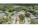Aerial view of homes in a wooded area with lakes at 11022 Connacht Way, Tampa, FL 33610